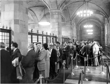 Individuals waiting inline at the first floor cages of the Bank to purchase U.S. securities. 