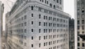 A historic view of the New York Fed building from the corner of Maiden Lane and Nassau Street in July of 1923. Bank employees settled into their new office building the following year.