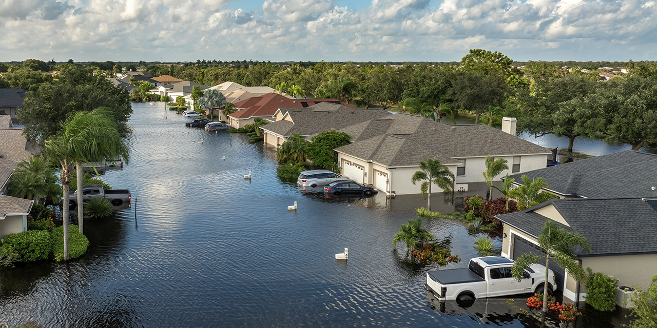 tropical rainstorm flooded residential homes and cars in suburban community
