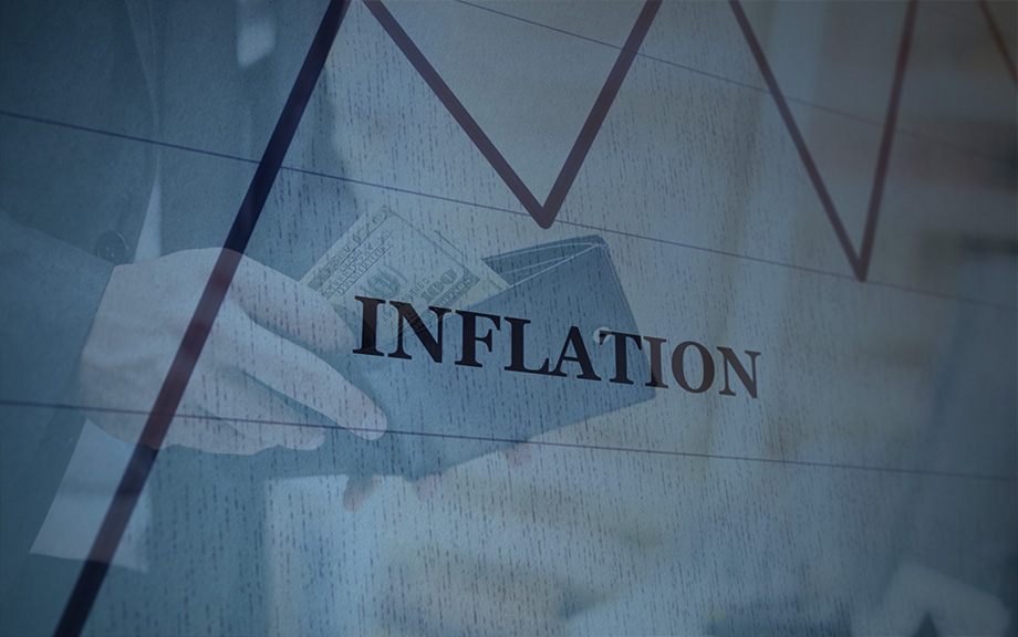 closeup of hand taking U.S. currency bills out of a wallet with an overlay of a chart line and the word inflation