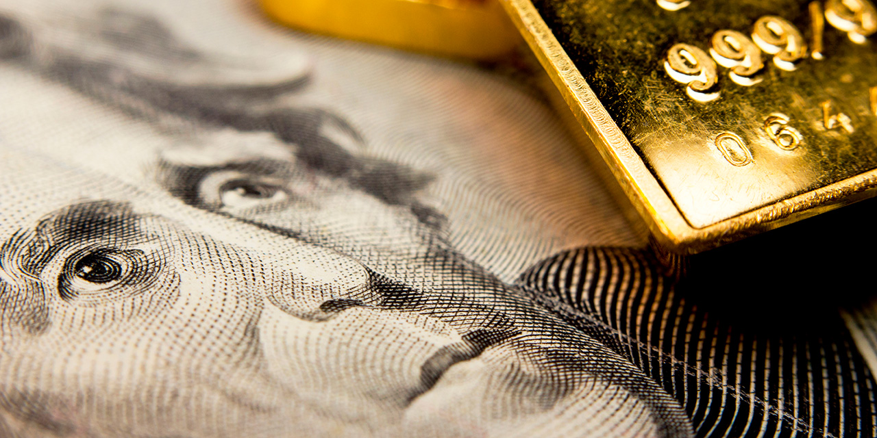 gold commodity appears with twenty dollar bill